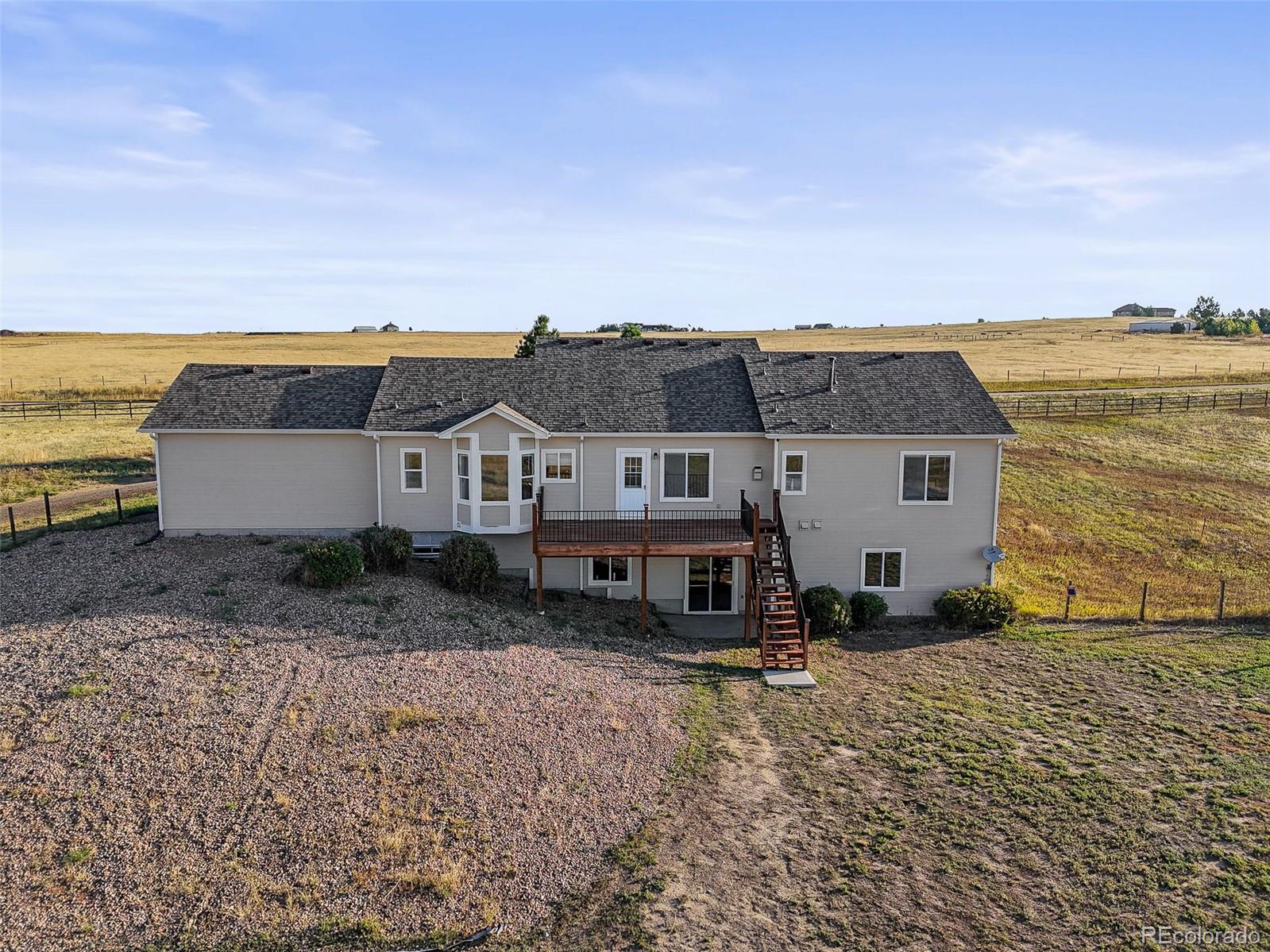 7498 Patrick Trail Elizabeth, CO 80107 - Photo 33 of 45 a view of a big house with a big yard