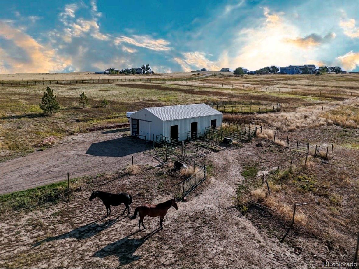 7498 Patrick Trail Elizabeth, CO 80107 - Photo 4 of 45 a view of a lake from a yard