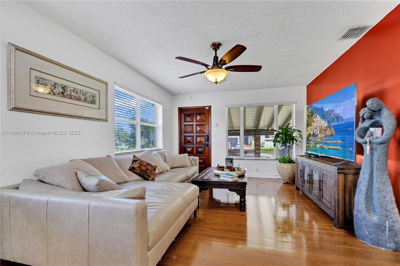 3300 Southwest 80th Avenue Miami, FL 33155 - Photo 11 of 31 a living room with furniture and a large window