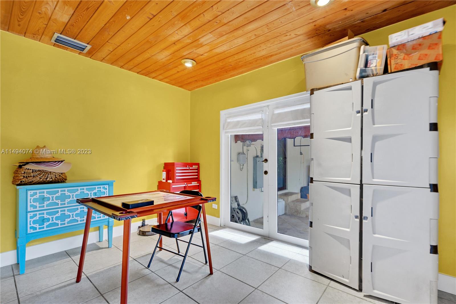 3300 Southwest 80th Avenue Miami, FL 33155 - Photo 19 of 31 a backyard of a house with table and chairs