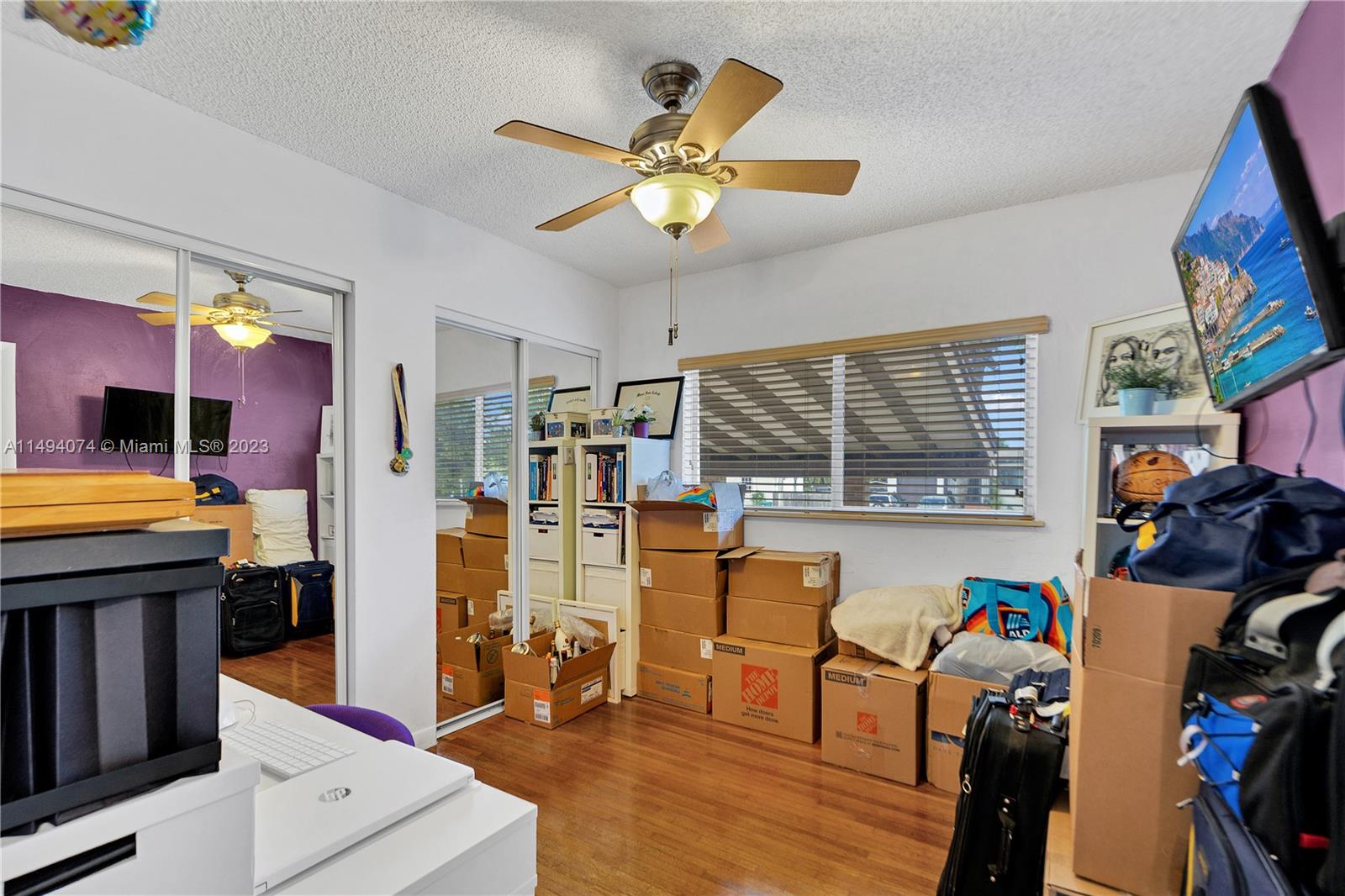 3300 Southwest 80th Avenue Miami, FL 33155 - Photo 20 of 31 a view of a dining room with furniture a chandelier and wooden floor