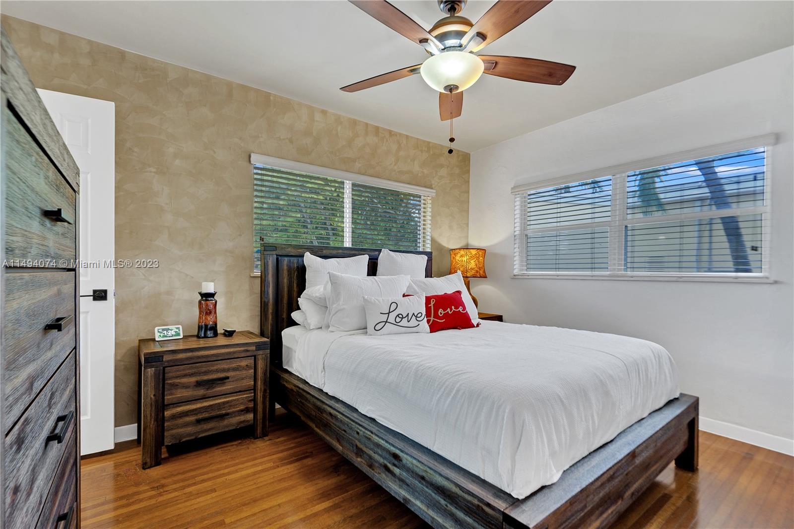 3300 Southwest 80th Avenue Miami, FL 33155 - Photo 22 of 31 a bedroom with a bed and wooden floor