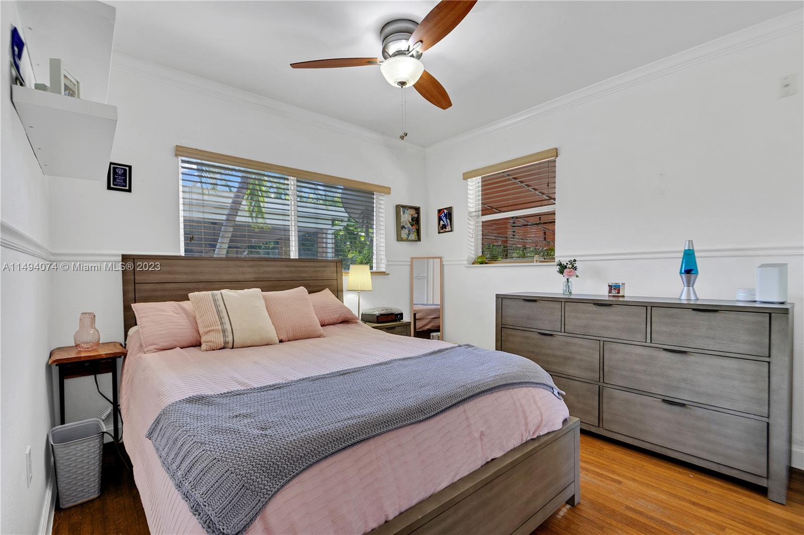 3300 Southwest 80th Avenue Miami, FL 33155 - Photo 25 of 31 a bedroom with a large bed and a chandelier