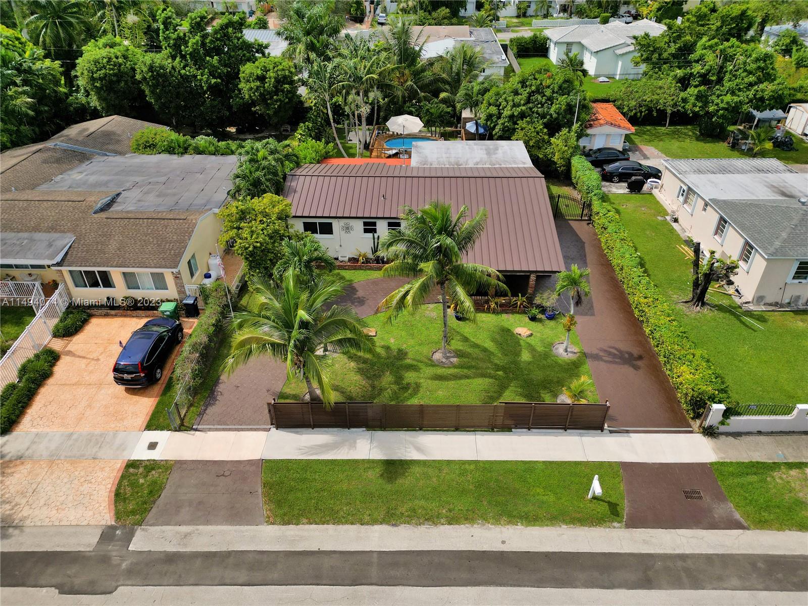 3300 Southwest 80th Avenue Miami, FL 33155 - Photo 3 of 31 an aerial view of a house with a yard and lake view