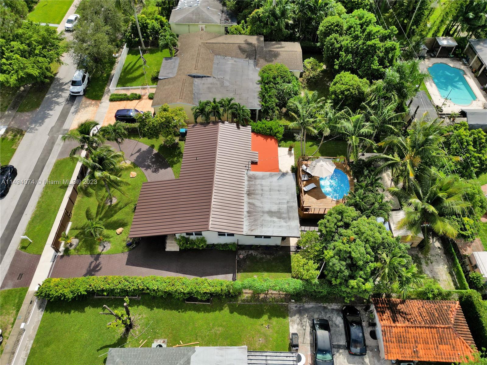 3300 Southwest 80th Avenue Miami, FL 33155 - Photo 8 of 31 an aerial view of a house with a yard and a large tree