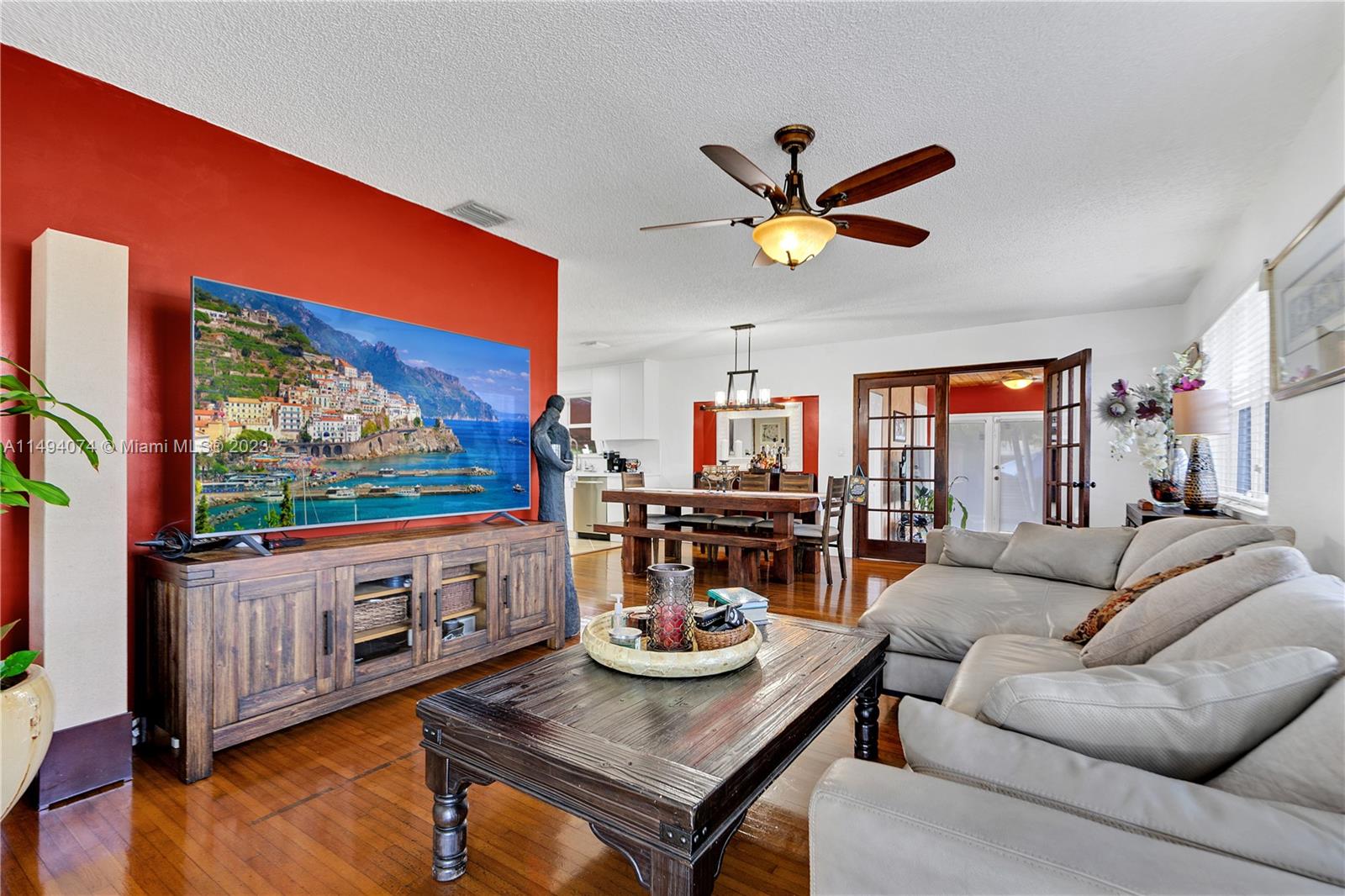 3300 Southwest 80th Avenue Miami, FL 33155 - Photo 10 of 31 a living room with furniture a rug and a floor to ceiling window