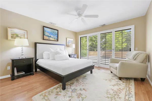 a spacious bedroom with a bed and a couch