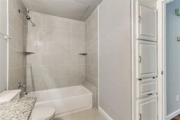 a bathroom with a bathtub and shower