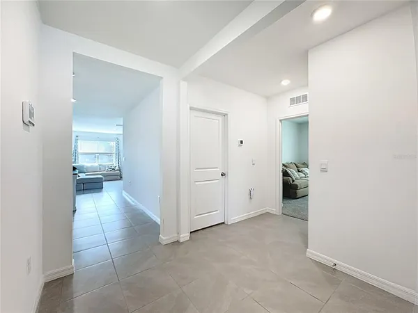 a kitchen with stainless steel appliances granite countertop a refrigerator sink and stove