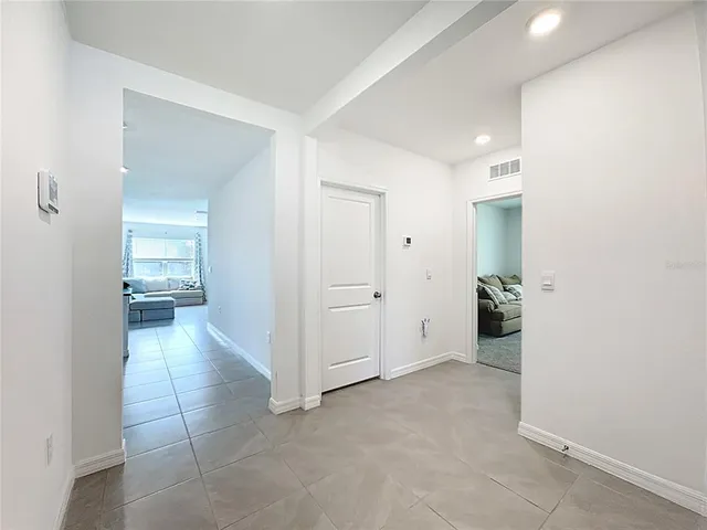 a kitchen with stainless steel appliances granite countertop a refrigerator sink and stove