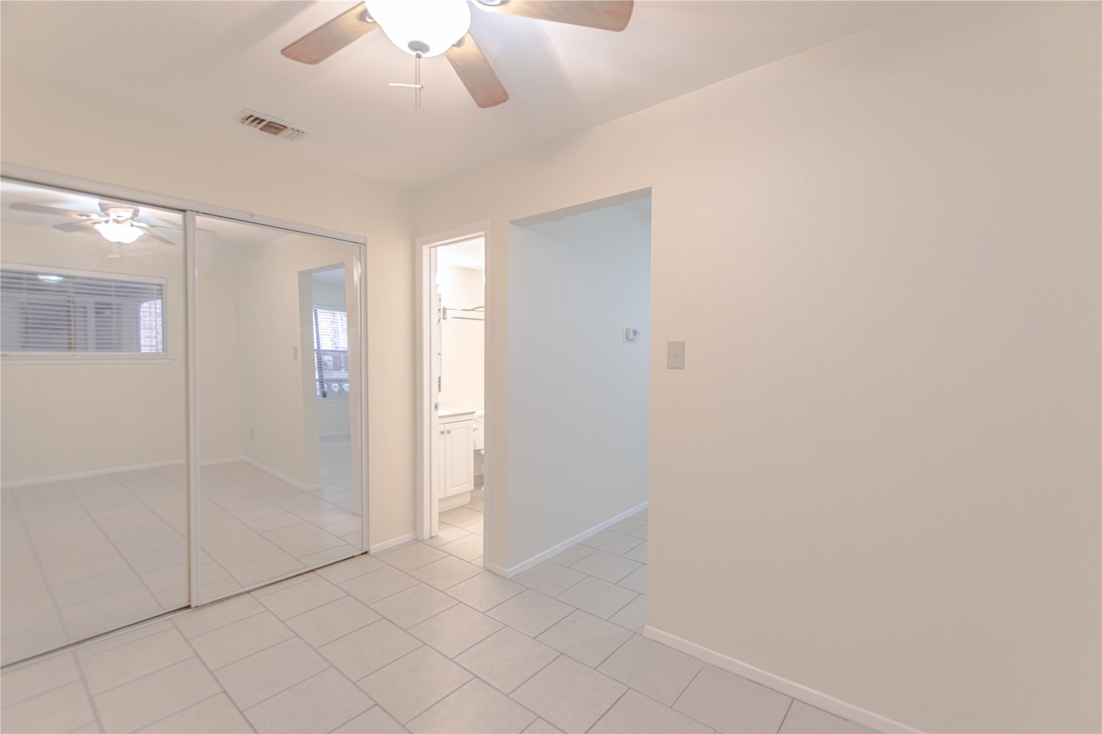 2500 Burleson Road, Unit 601 Austin, TX 78741 - Photo 11 of 20 an empty room with fan and entrance
