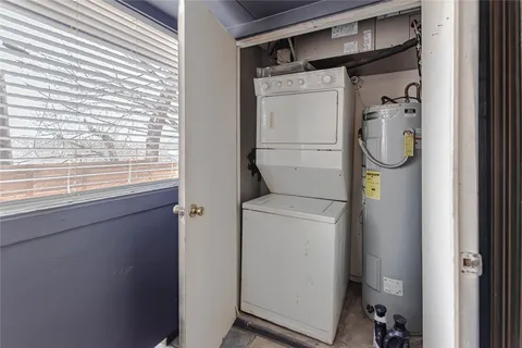 a bathroom with a shower and a window