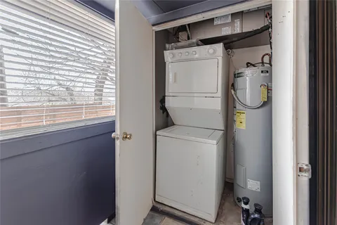 a bathroom with a shower and a window