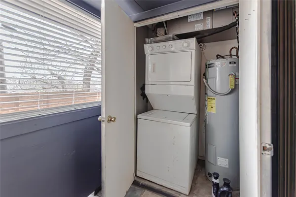 a bathroom with a shower and a window
