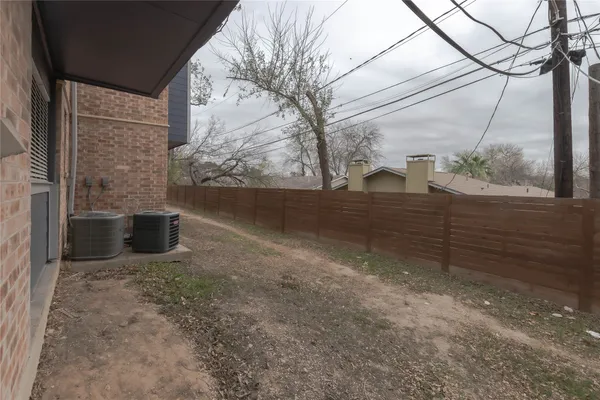 a view of a back yard of the house