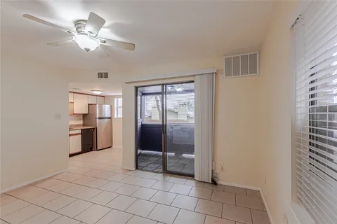 a view of a kitchen with a sink and a refrigerator cabinets