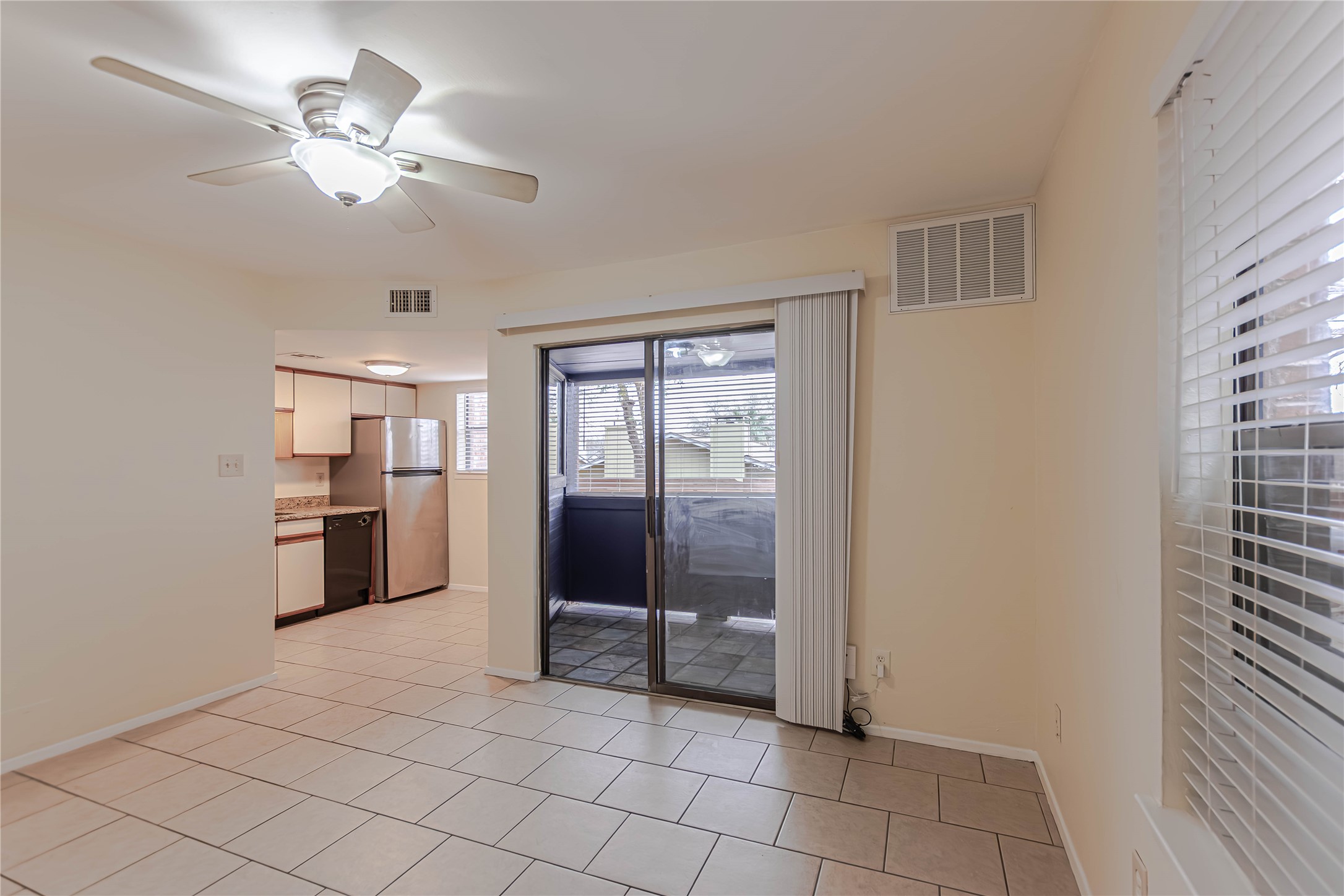 2500 Burleson Road, Unit 601 Austin, TX 78741 - Photo 2 of 20 a view of a kitchen with a sink and a refrigerator cabinets