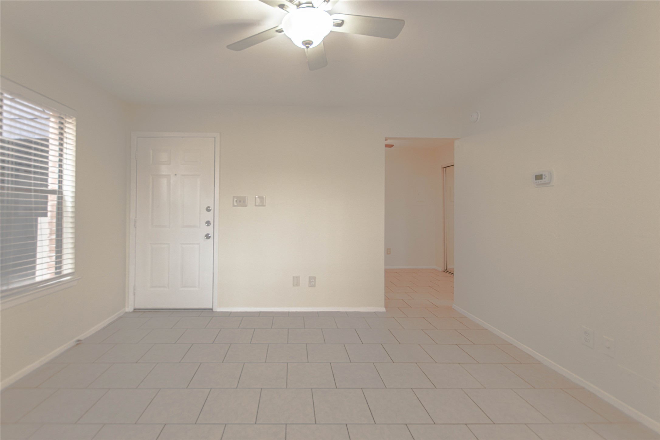 2500 Burleson Road, Unit 601 Austin, TX 78741 - Photo 5 of 20 an empty room with chandelier fan