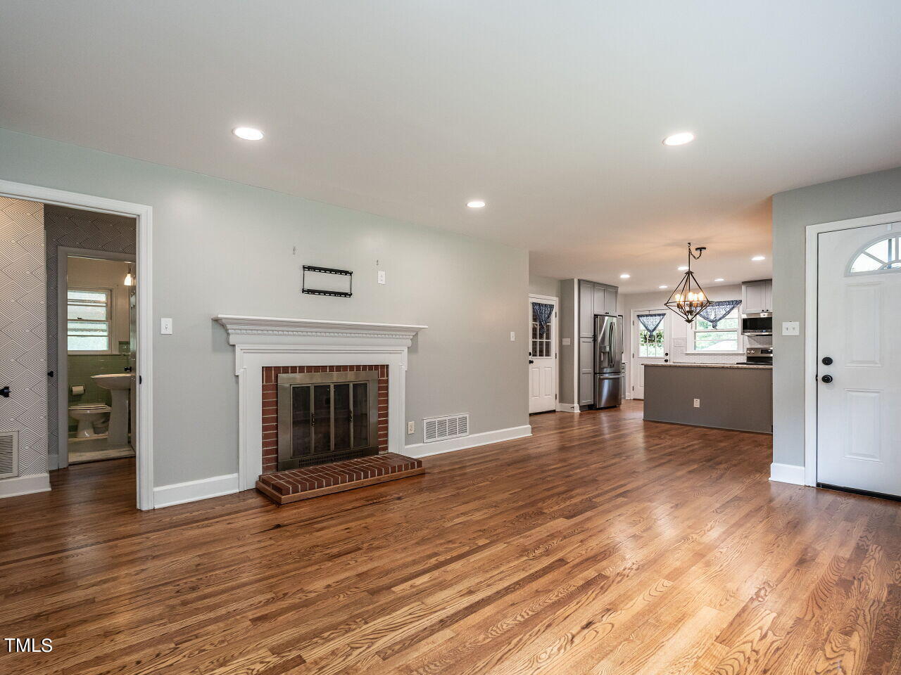 7800 White Oak Road Garner, NC 27529 - Photo 11 of 37 a view of a kitchen with a sink and a fireplace