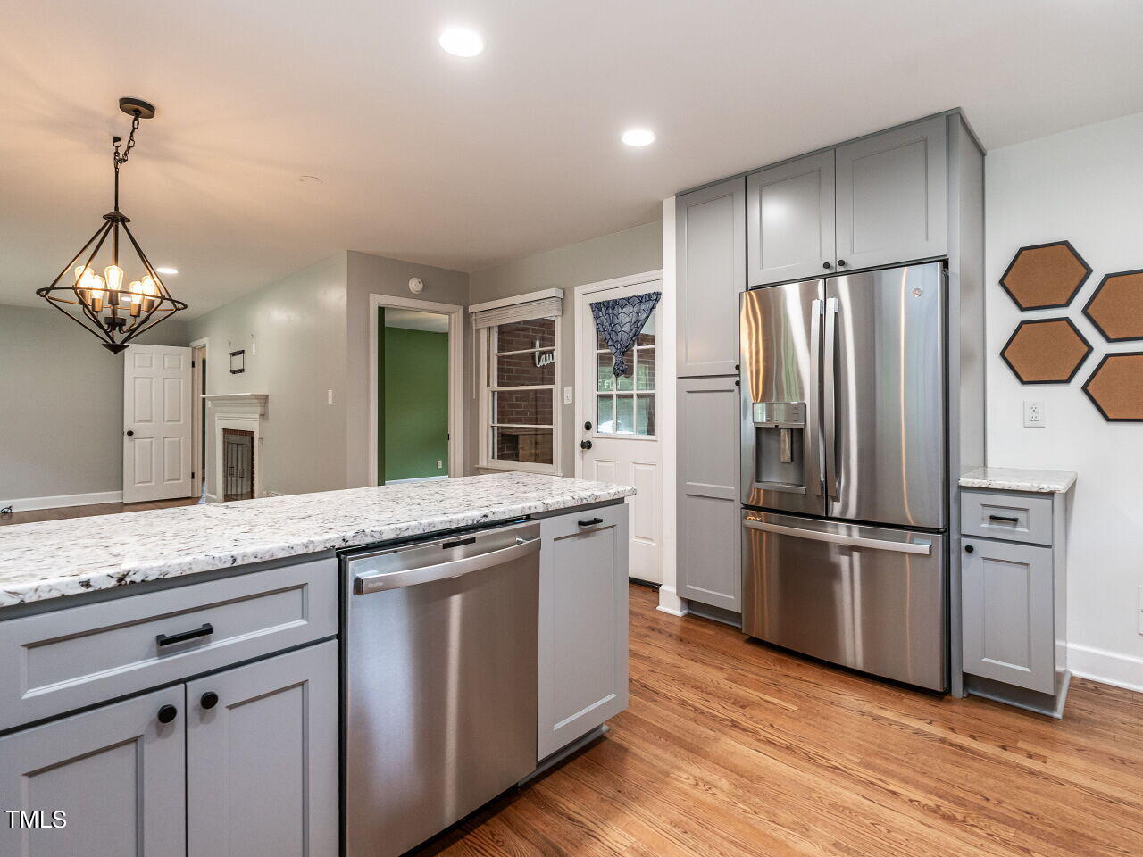 7800 White Oak Road Garner, NC 27529 - Photo 18 of 37 a kitchen with granite countertop a refrigerator and a sink