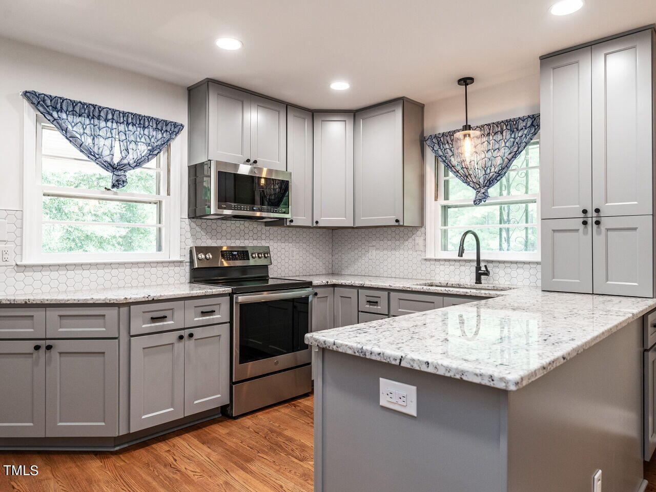 7800 White Oak Road Garner, NC 27529 - Photo 2 of 37 a kitchen with stainless steel appliances granite countertop a sink stove and refrigerator