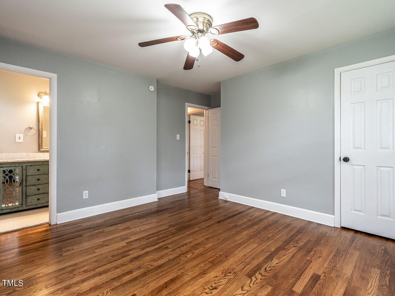 7800 White Oak Road Garner, NC 27529 - Photo 26 of 37 a view of an empty room with window and wooden floor