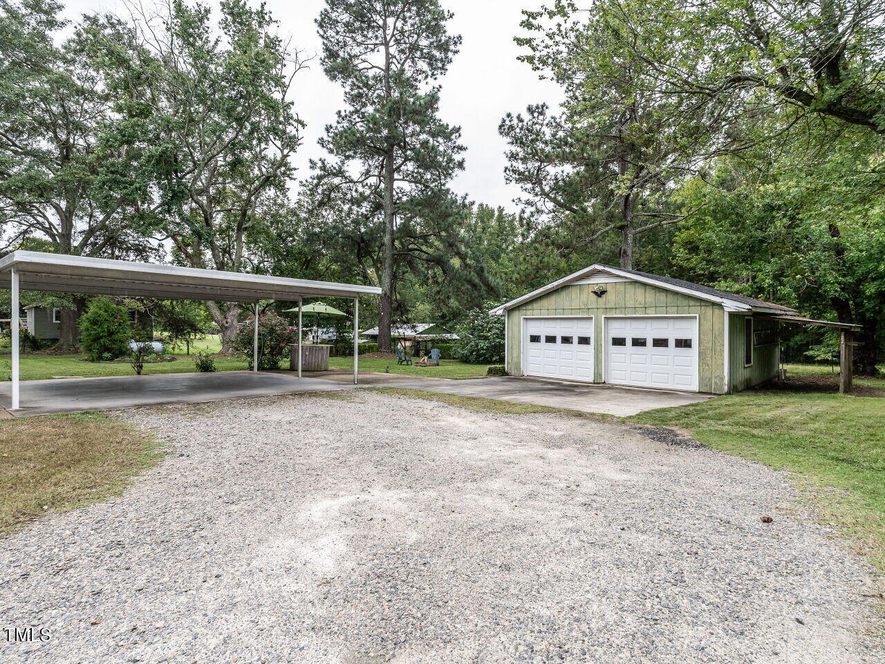 7800 White Oak Road Garner, NC 27529 - Photo 30 of 37 a view of a house with backyard and garden