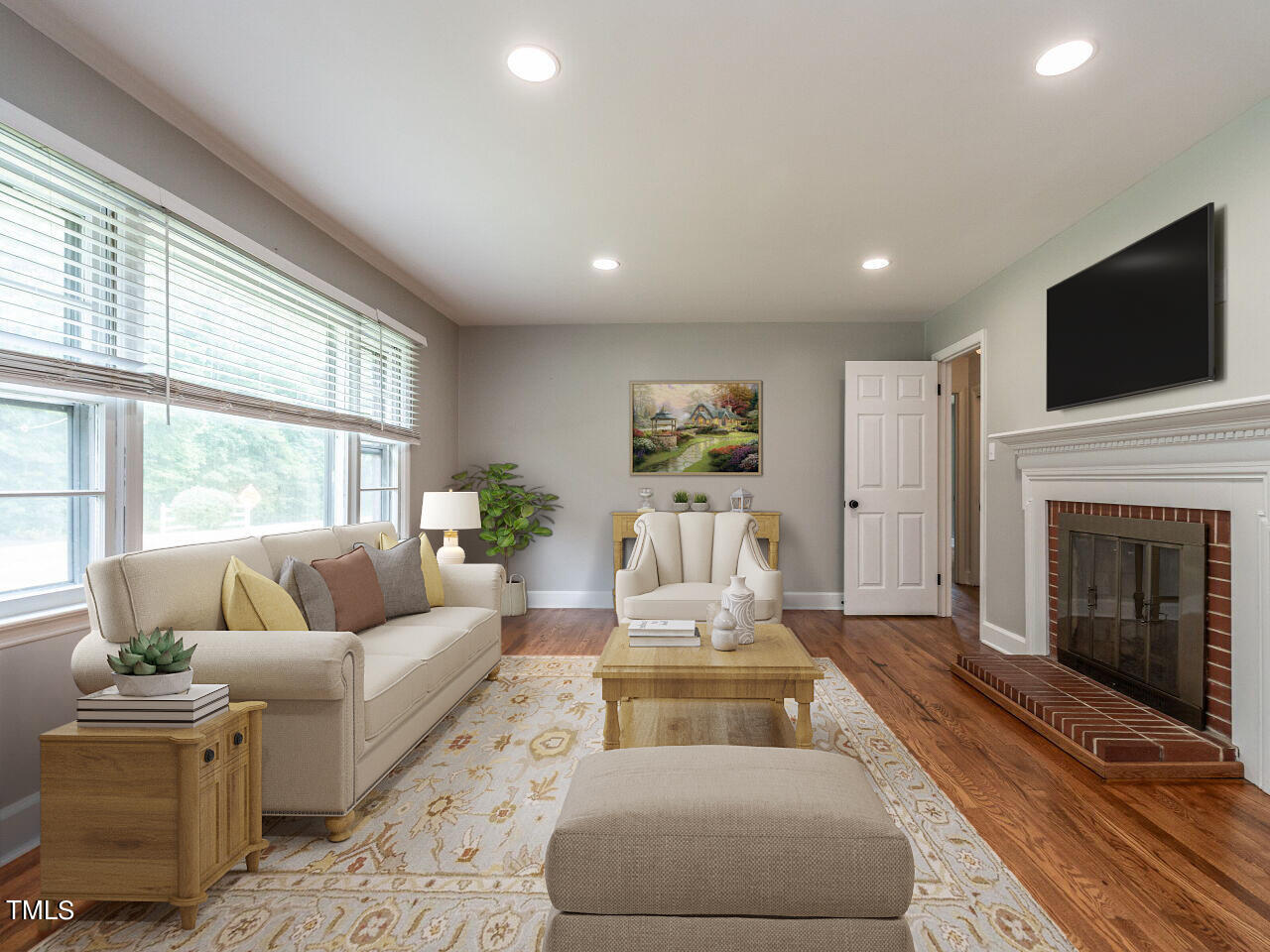 7800 White Oak Road Garner, NC 27529 - Photo 4 of 37 a living room with furniture fireplace and flat screen tv