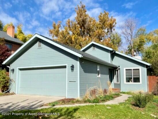 452 West 3rd Street Rifle, CO 81650 - Photo 1 of 1 a front view of a house with garden