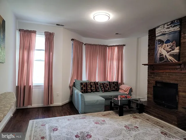 a bedroom with furniture and a fireplace