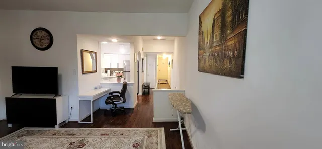 a view of living room with furniture and flat screen tv