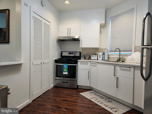 a kitchen with a sink and cabinets