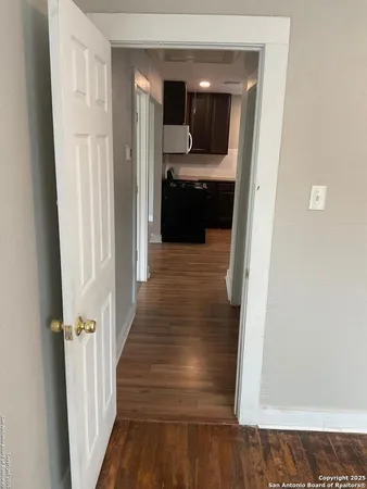 a bathroom with a sink and glass door