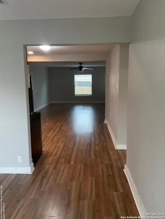 a view of gallery with wooden floor