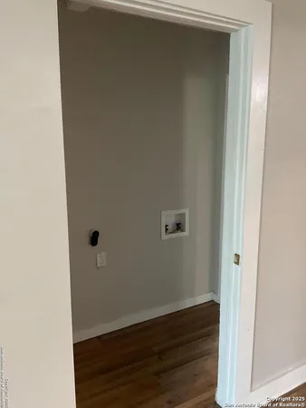 an empty room with wooden floor