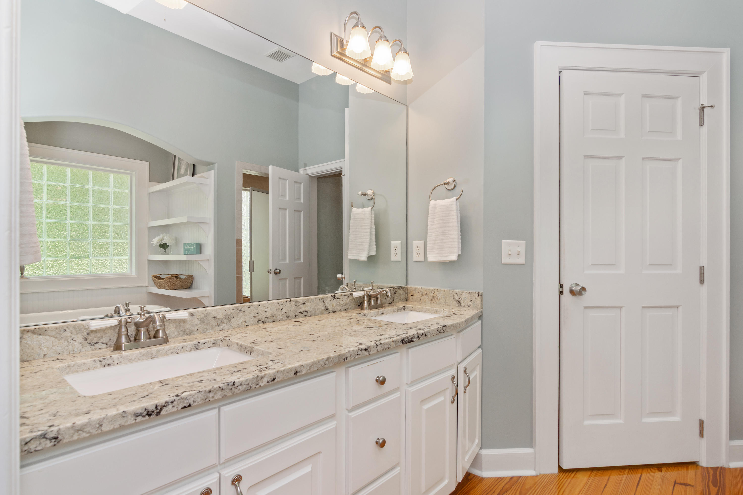376 Seabreeze Circle Inlet Beach, FL 32461 - Photo 17 of 58 a bathroom with a granite countertop double vanity sink and a mirror