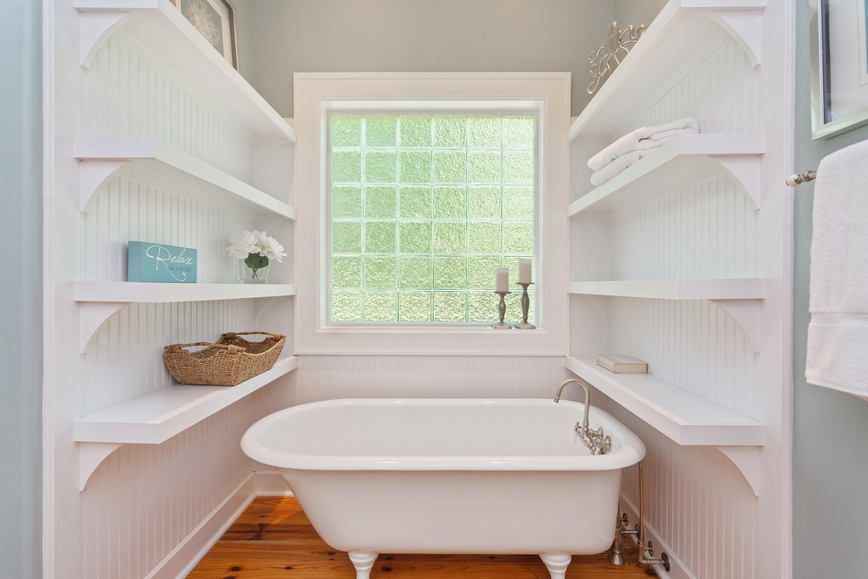 376 Seabreeze Circle Inlet Beach, FL 32461 - Photo 18 of 58 a bathroom with a bathtub and a window