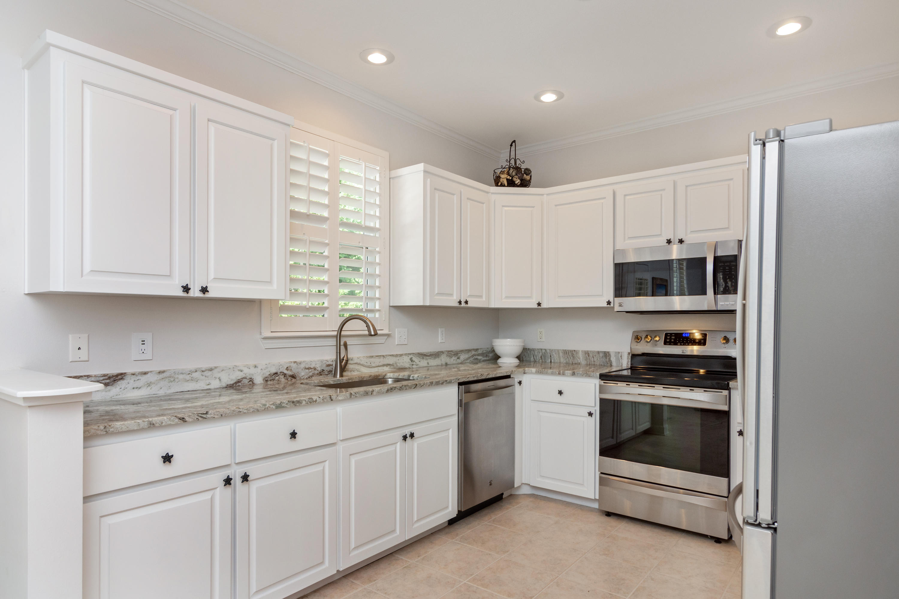 376 Seabreeze Circle Inlet Beach, FL 32461 - Photo 25 of 58 a kitchen with stainless steel appliances granite countertop a stove a sink and a refrigerator