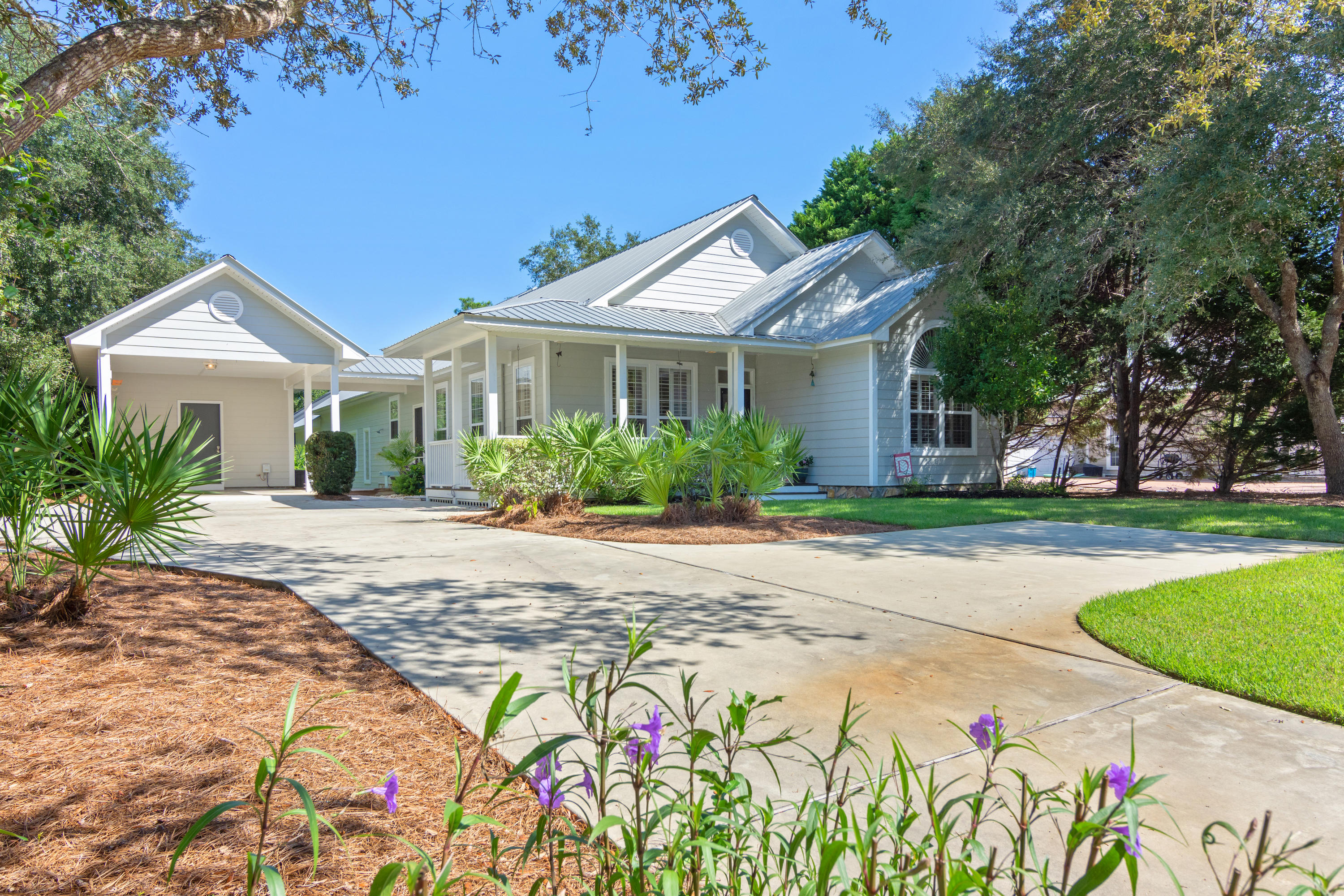 376 Seabreeze Circle Inlet Beach, FL 32461 - Photo 52 of 58 a front view of a house with garden