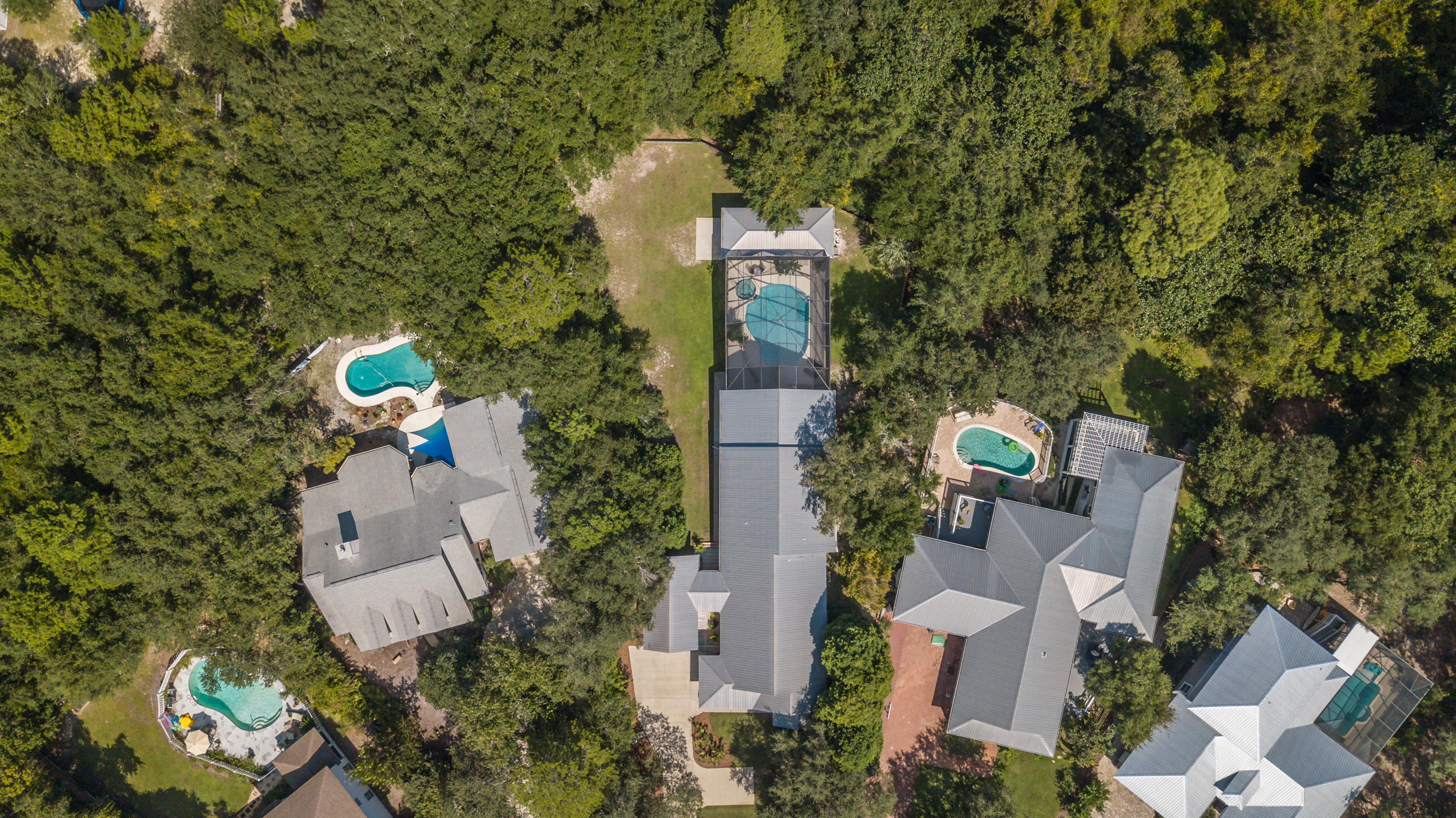 376 Seabreeze Circle Inlet Beach, FL 32461 - Photo 53 of 58 an aerial view of a house with outdoor space and trees all around