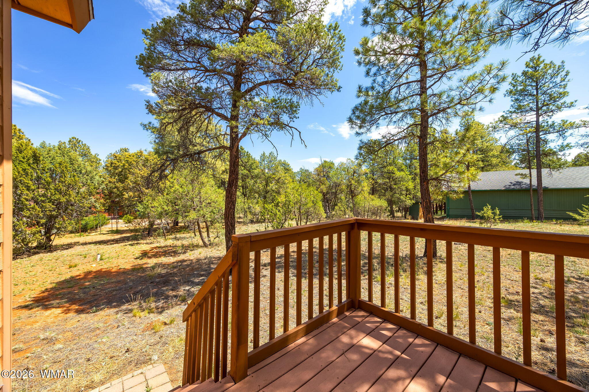 2937 Ransack Road Overgaard, AZ 85933 - Photo 8 of 34 a view of a wooden deck next to a yard