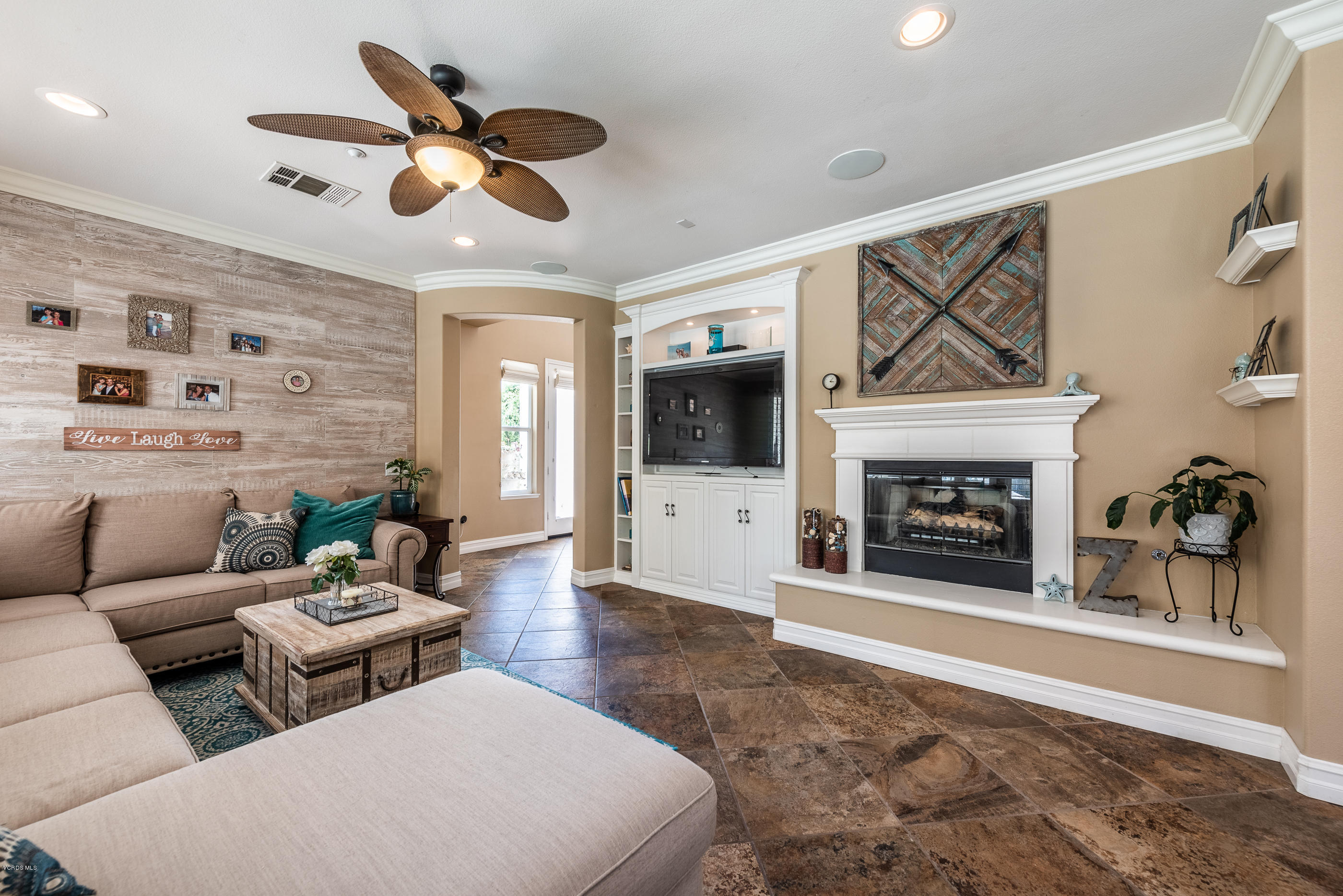 1469 Hidden Ranch Drive Simi Valley, CA 93063 - Photo 16 of 49 a living room with furniture a fireplace and a flat screen tv