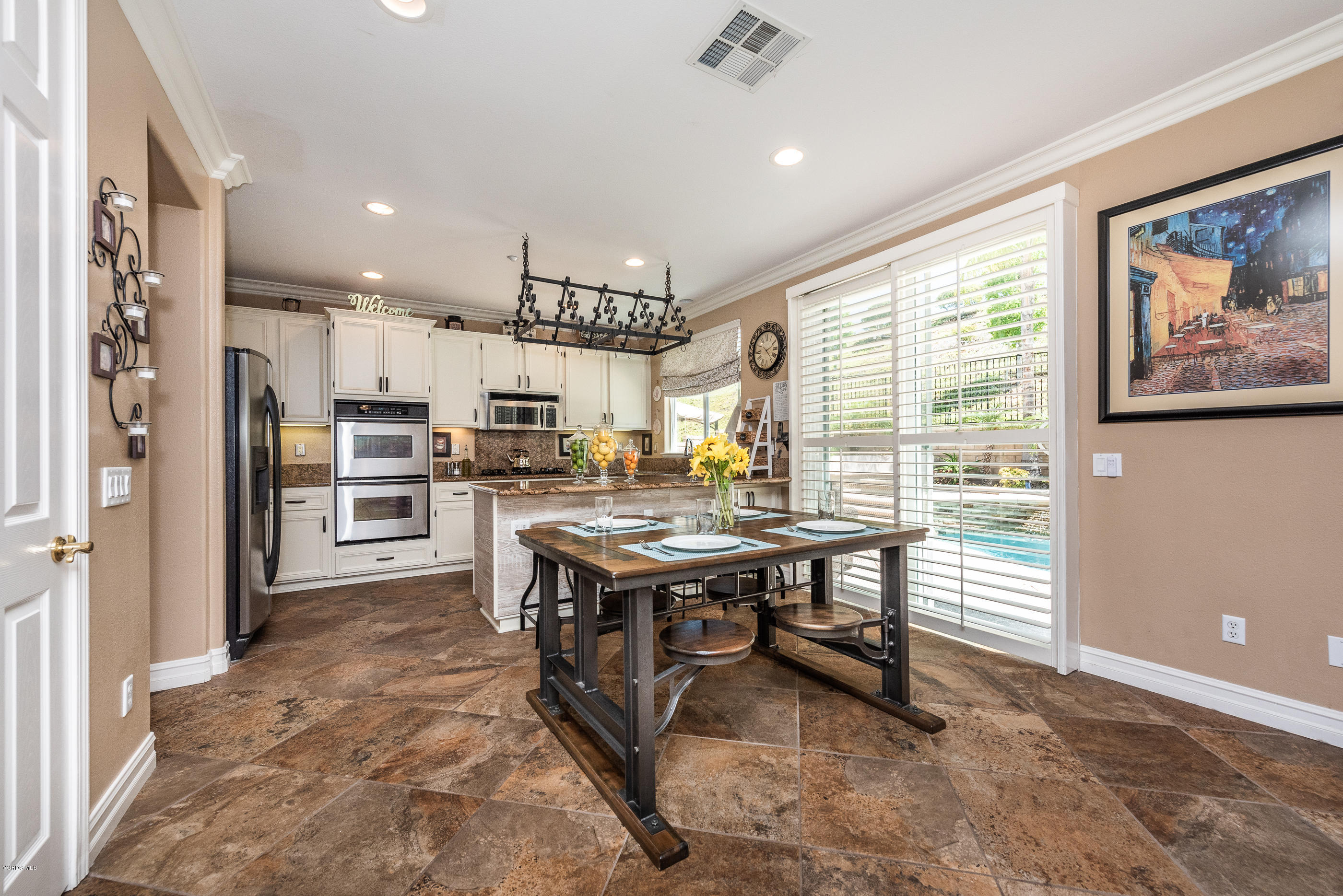 1469 Hidden Ranch Drive Simi Valley, CA 93063 - Photo 17 of 49 a view of a kitchen with kitchen island stainless steel appliances granite countertop a stove and a refrigerator