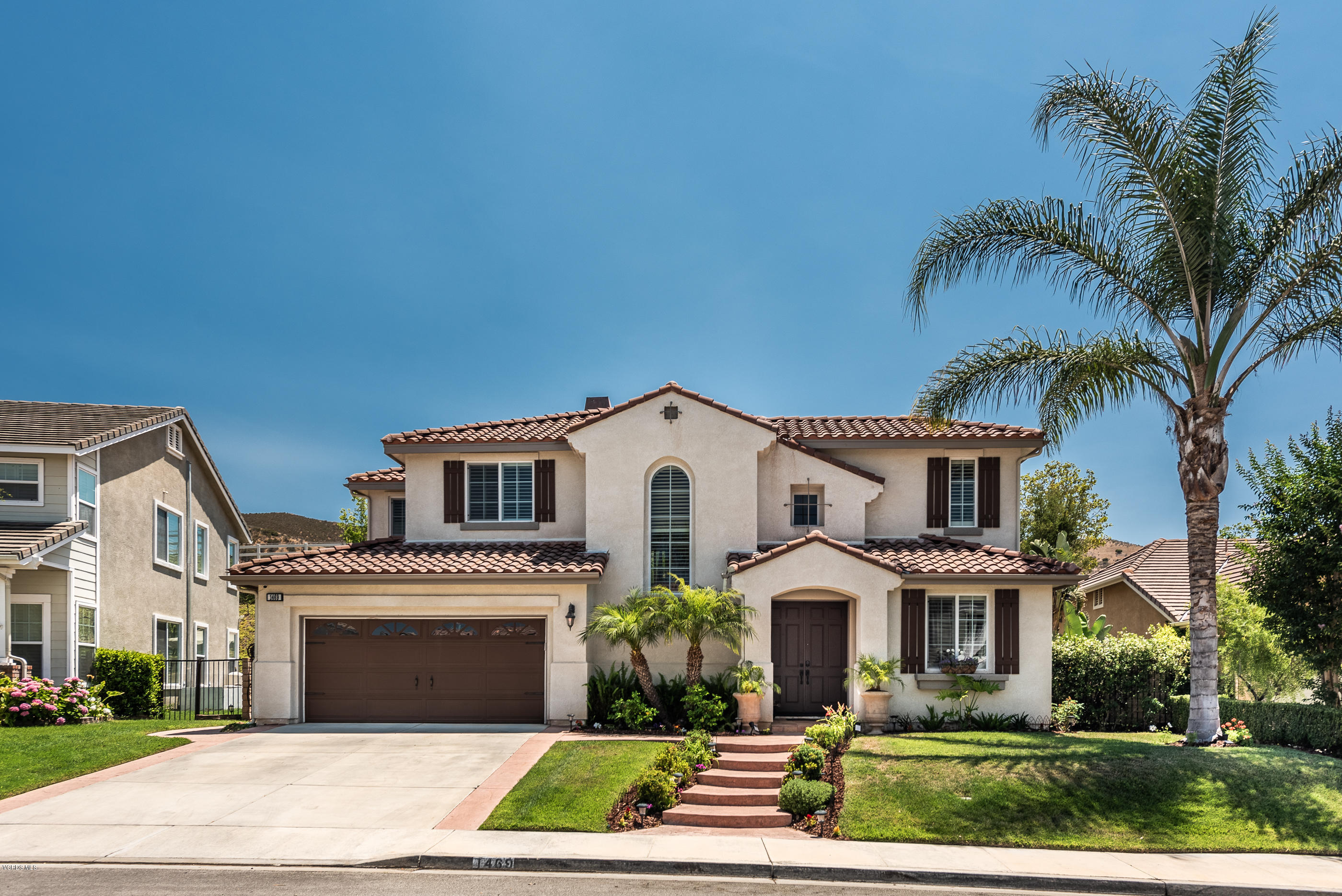1469 Hidden Ranch Drive Simi Valley, CA 93063 - Photo 3 of 49 a front view of a house with a garden
