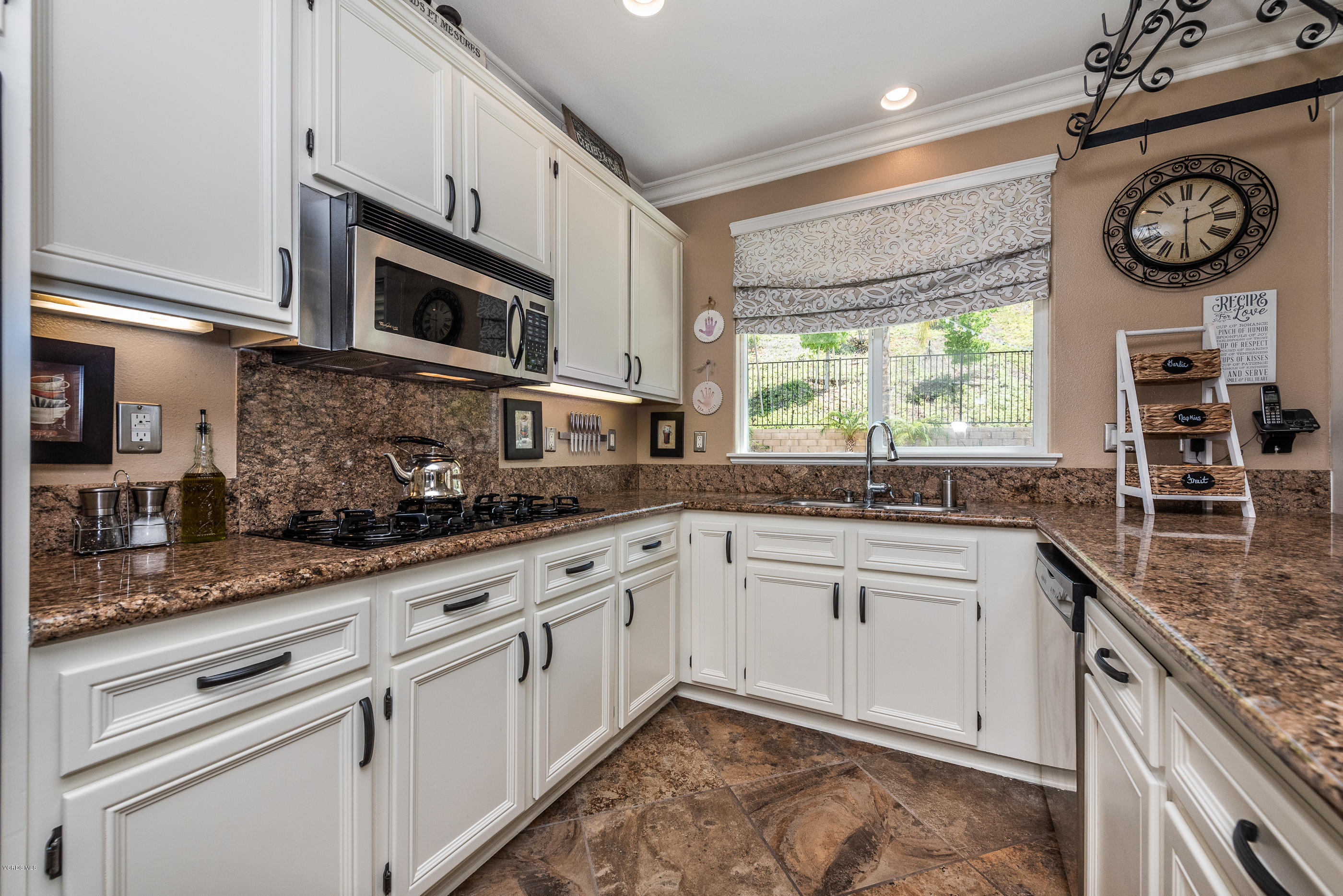 1469 Hidden Ranch Drive Simi Valley, CA 93063 - Photo 21 of 49 a kitchen with stainless steel appliances granite countertop a sink a stove and cabinets