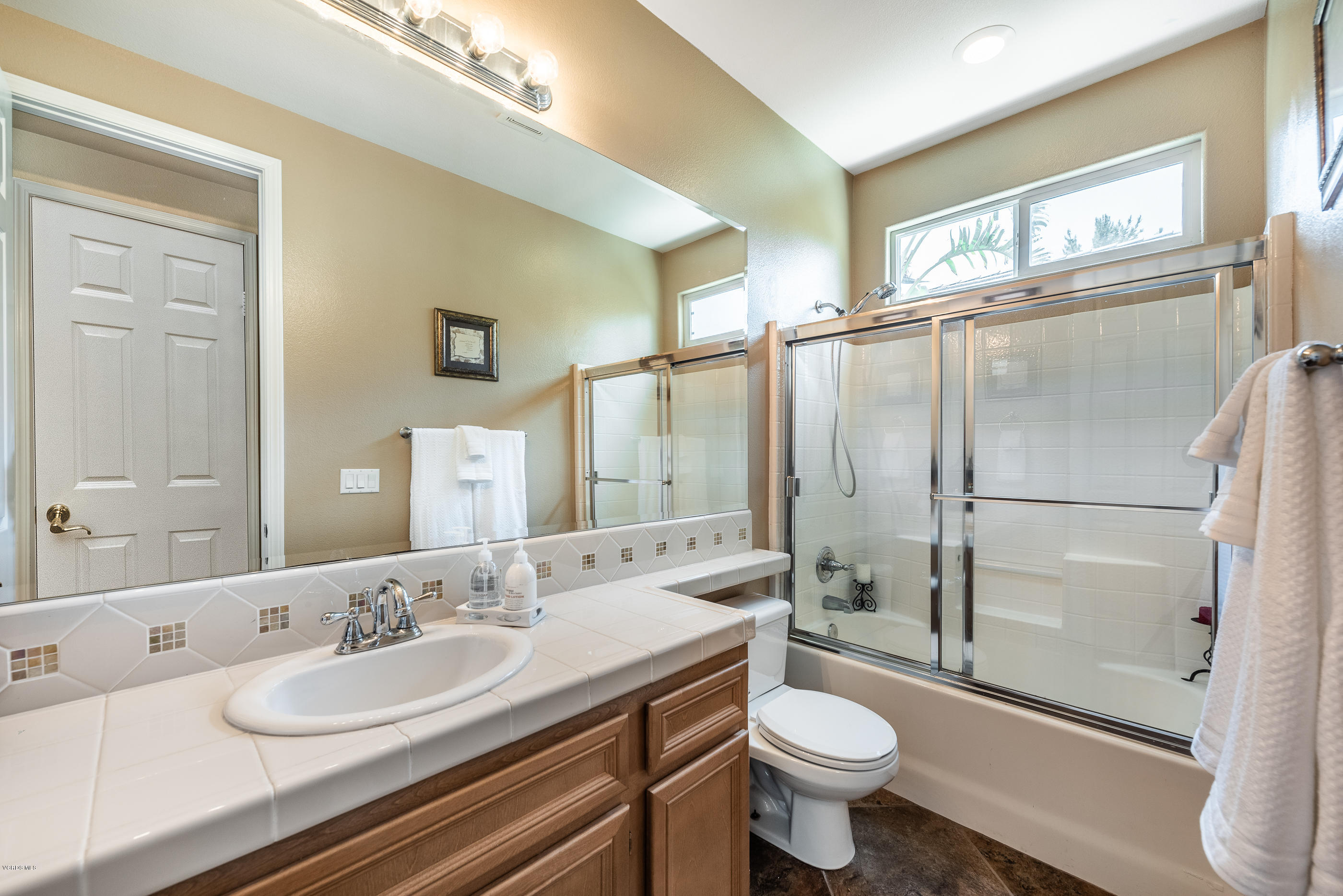 1469 Hidden Ranch Drive Simi Valley, CA 93063 - Photo 28 of 49 a bathroom with a sink a toilet and shower