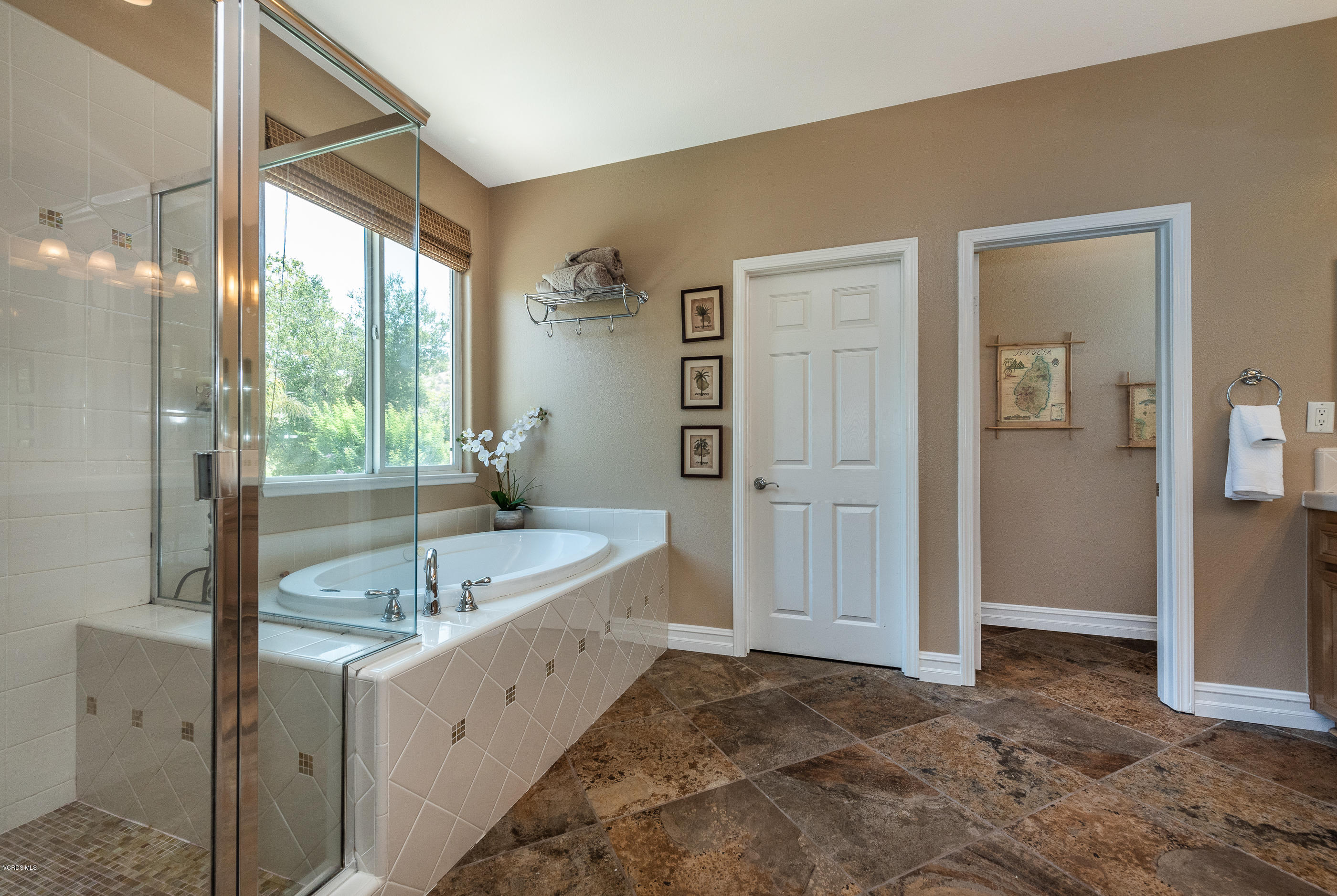 1469 Hidden Ranch Drive Simi Valley, CA 93063 - Photo 34 of 49 a bathroom with a tub sink and mirror