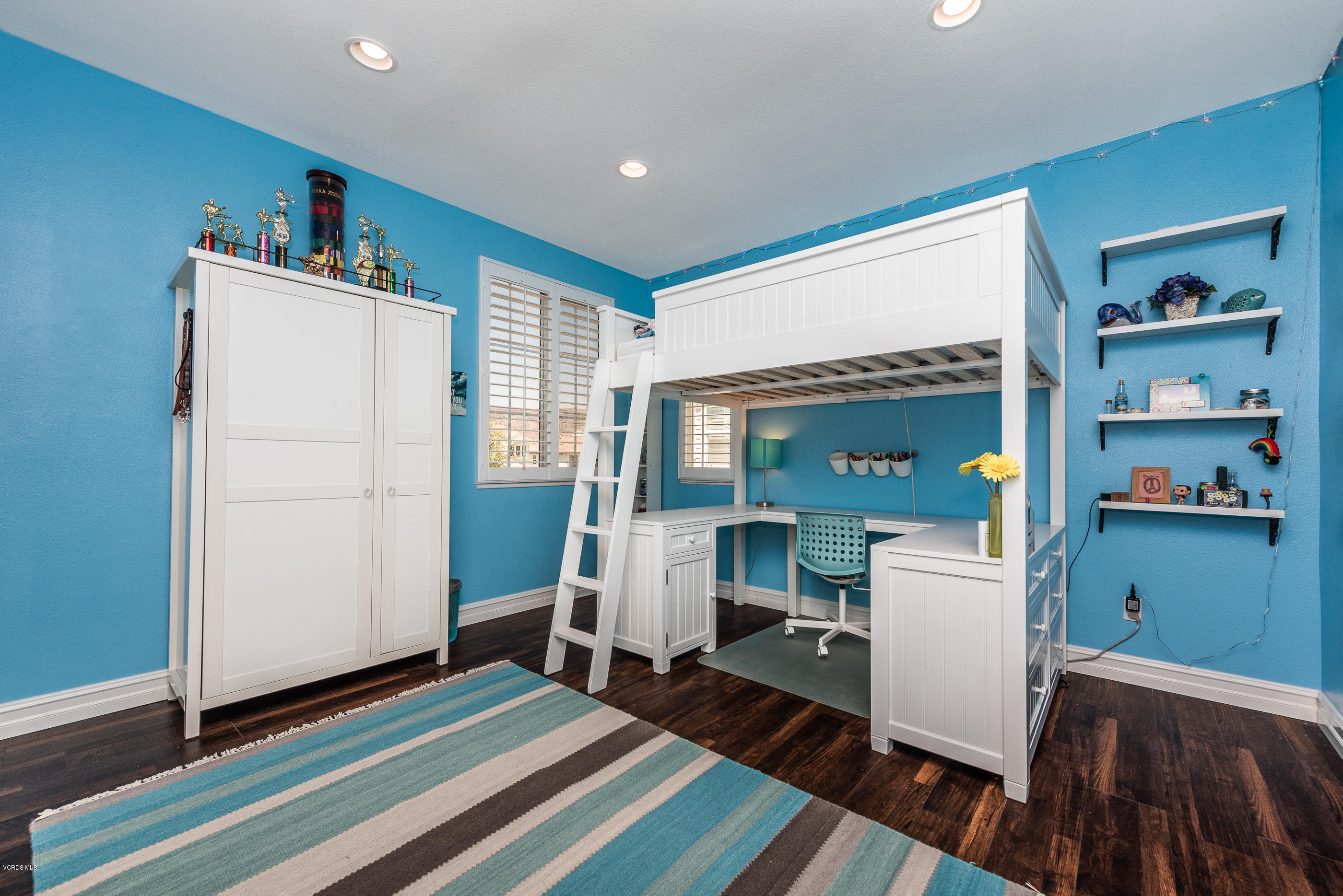 1469 Hidden Ranch Drive Simi Valley, CA 93063 - Photo 35 of 49 a room that has a bed and a chair in it