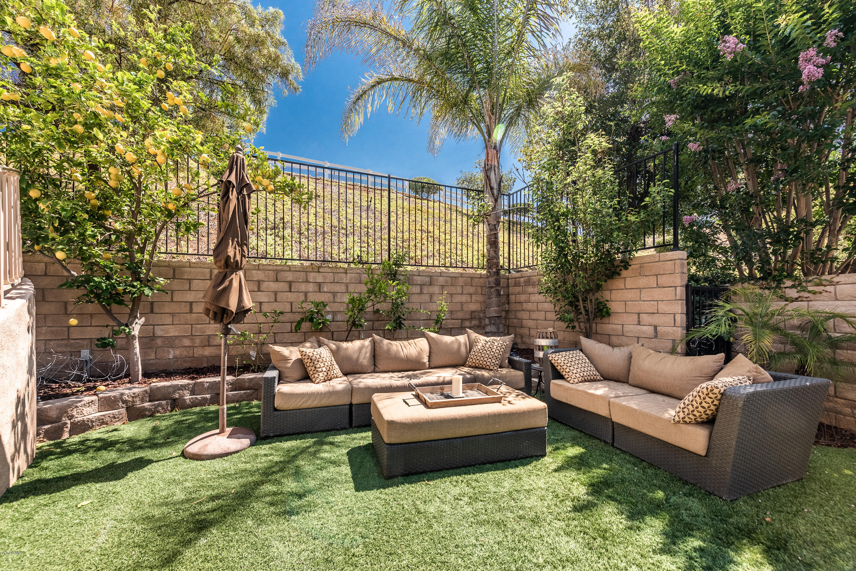 1469 Hidden Ranch Drive Simi Valley, CA 93063 - Photo 39 of 49 a view of a patio with couches and a fire pit and large trees