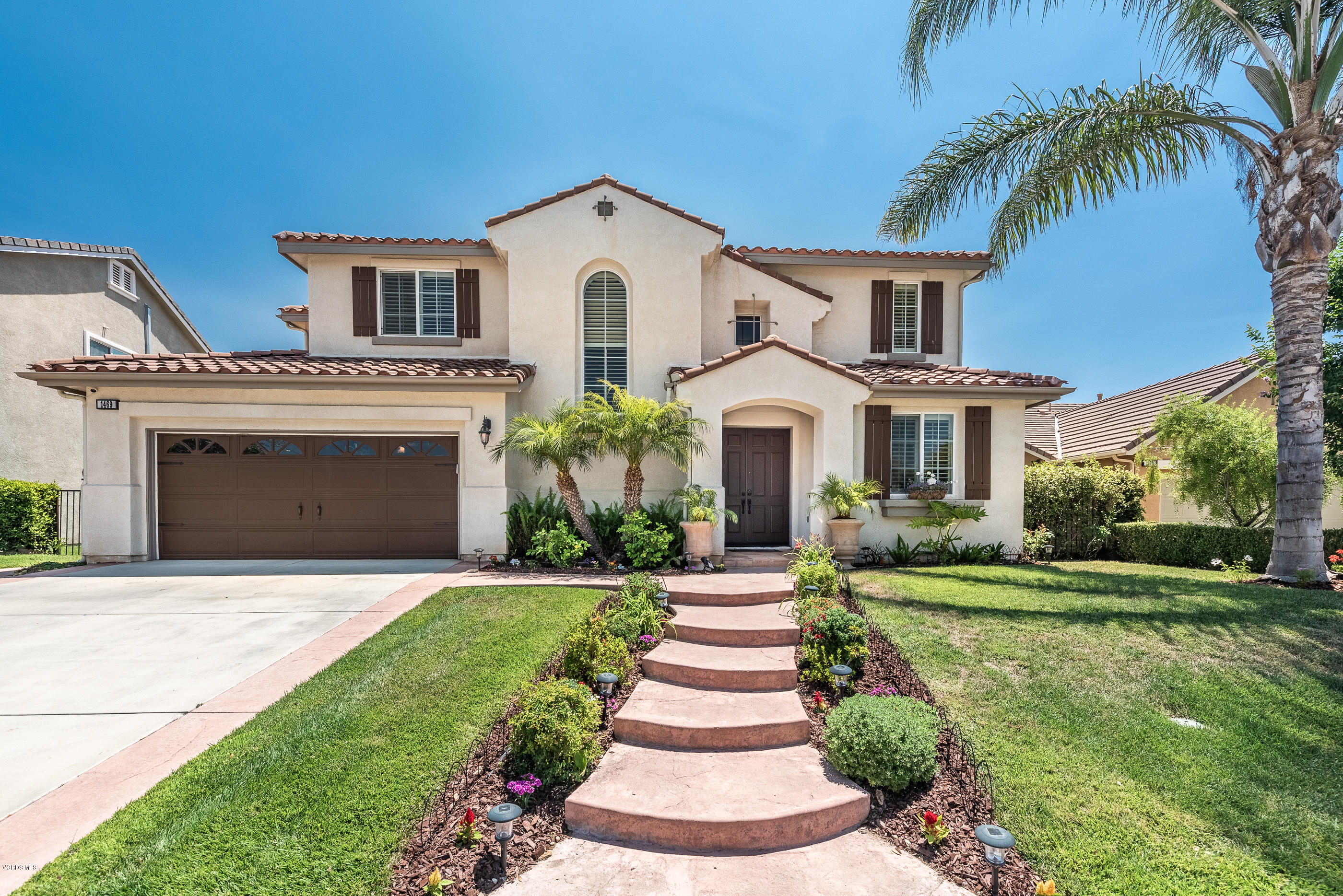 1469 Hidden Ranch Drive Simi Valley, CA 93063 - Photo 5 of 49 a front view of a house with a yard and trees